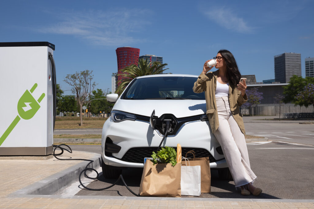 full-shot-woman-enjoying-coffee-near-car-1024x683 Green Technology Initiatives in the United States