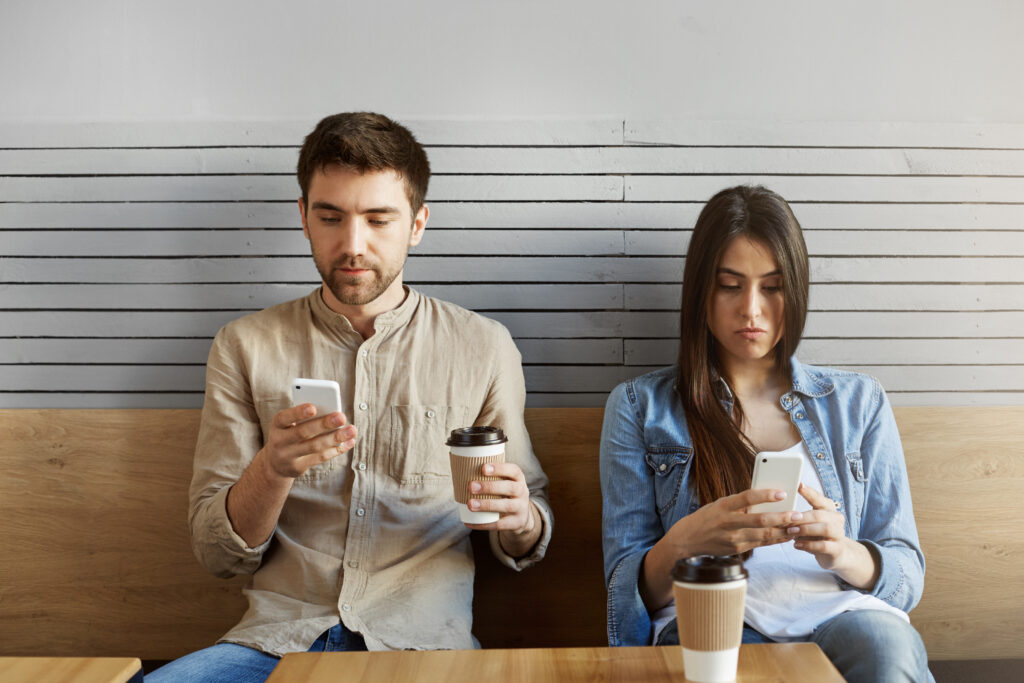 young-couple-students-sitting-date-fast-food-drinking-coffee-looking-cell-phones-ignoring-each-other-after-argument-1-1024x683 UNDERSTANDING DIVORCE AMONG TODAYS YOUTH