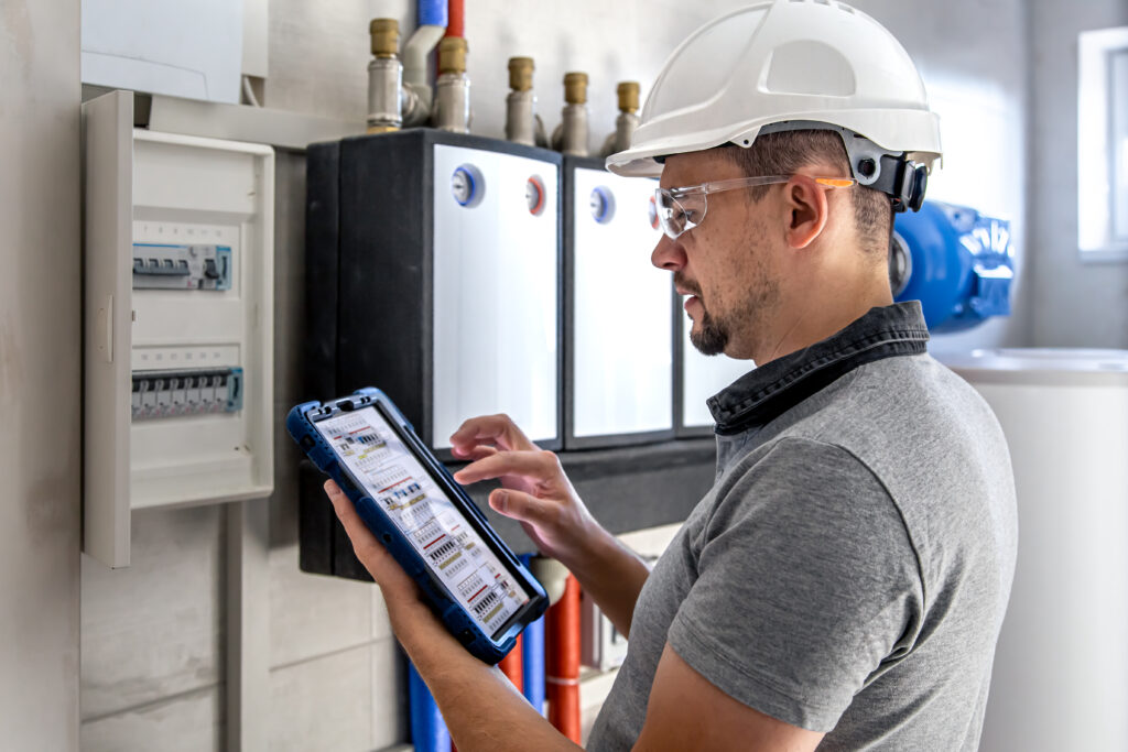 electrical-technician-looking-focused-while-working-switchboard-with-fuses-1024x683 Artificial Intelligence in American Industries