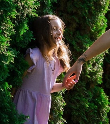 free-photo-of-woman-reaching-her-hand-toward-a-little-girl The Essence of Life